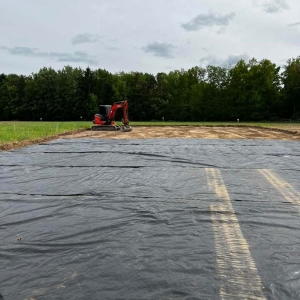 Pole barn pad with parking area